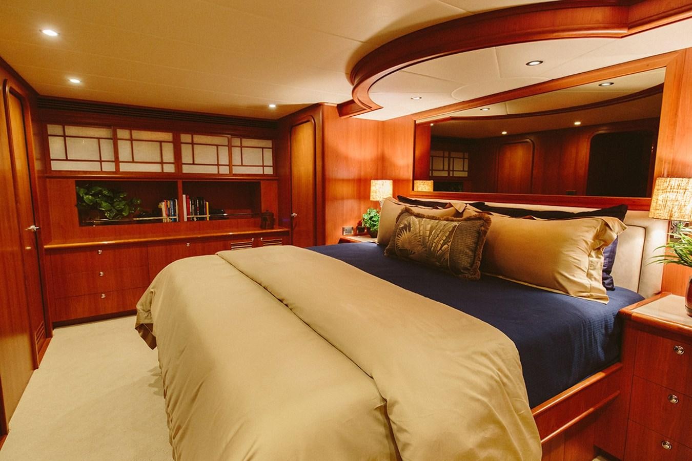 a bedroom with a bed and a desk aboard 44 NORTH Yacht for Sale