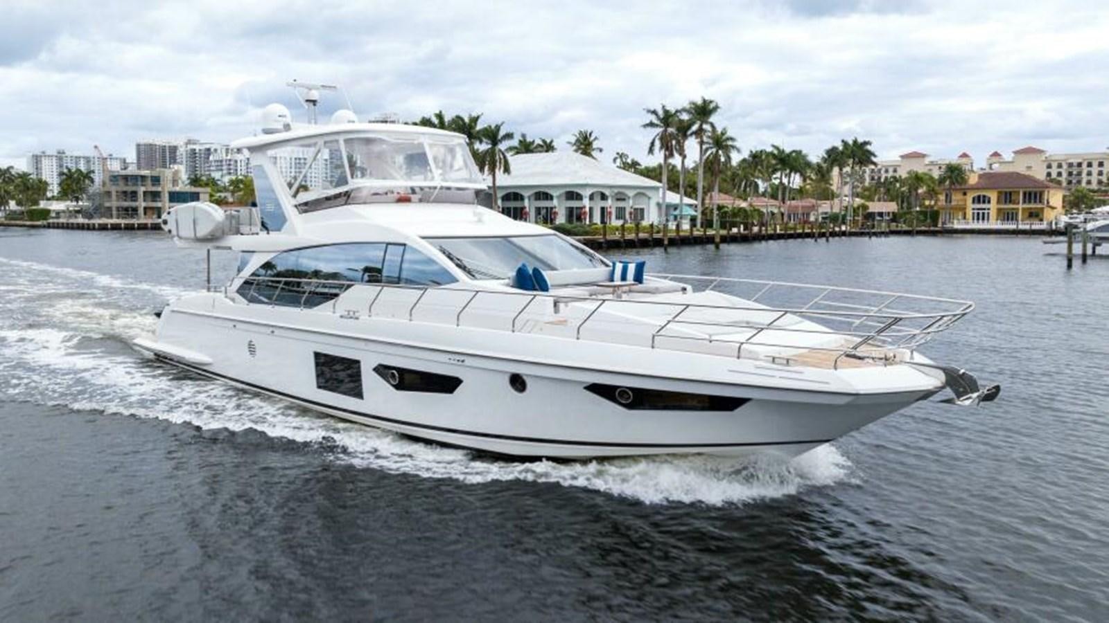 a white boat on the water aboard LIQUID ASSET Yacht for Sale