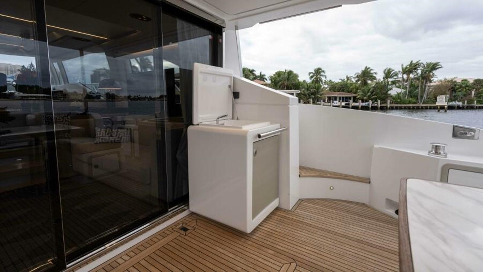a room with a large glass door aboard LIQUID ASSET Yacht for Sale