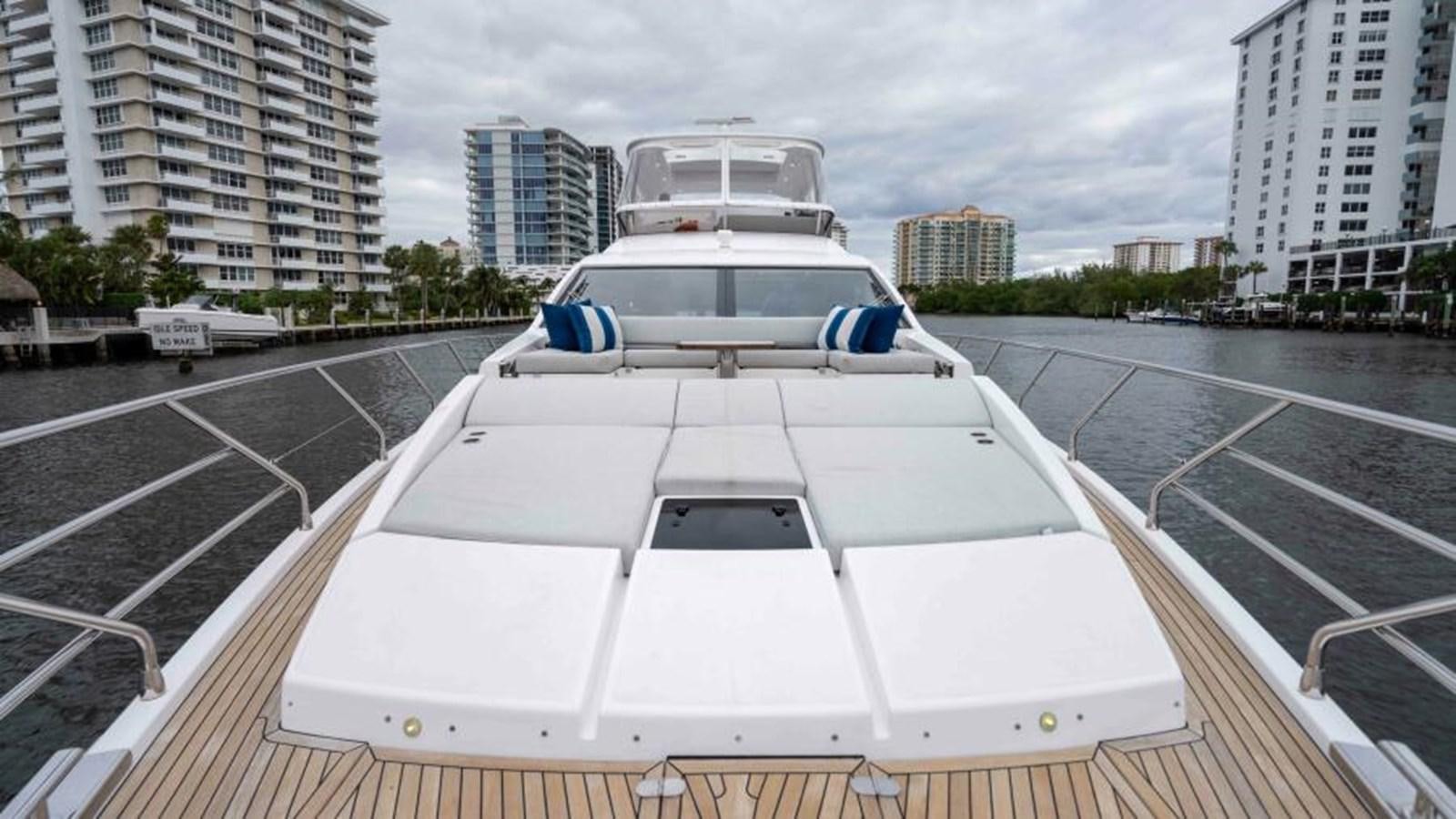 a white car on a road aboard LIQUID ASSET Yacht for Sale