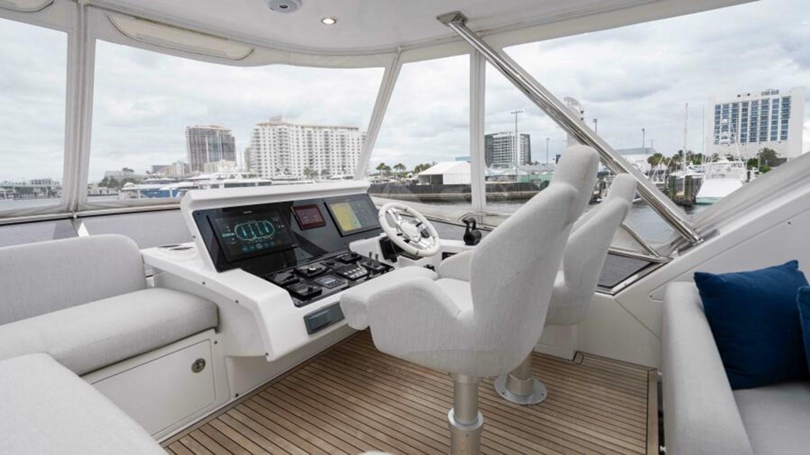 a white chair in a room with a table and computer aboard LIQUID ASSET Yacht for Sale