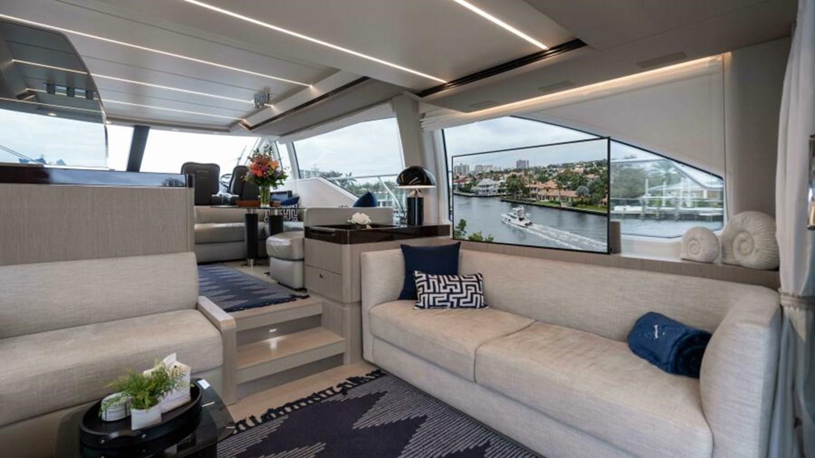 a living room with a large window aboard LIQUID ASSET Yacht for Sale