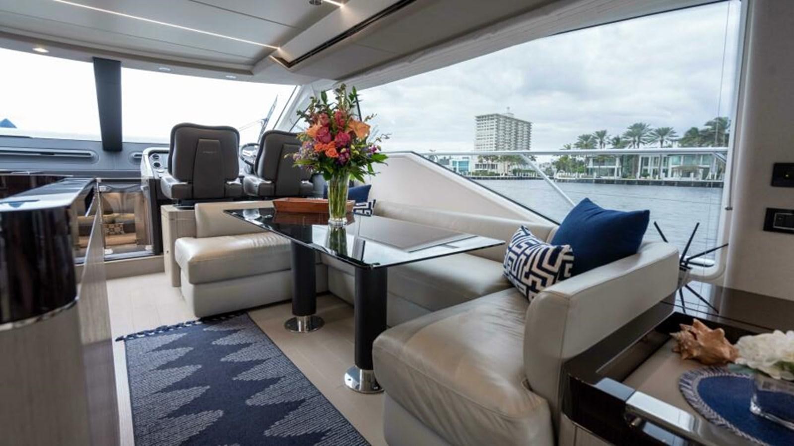 a living room with a large window aboard LIQUID ASSET Yacht for Sale