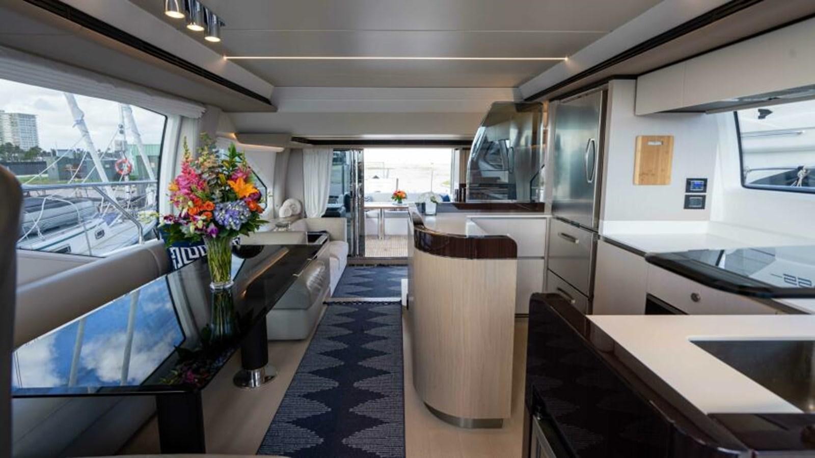 a room with a table and chairs aboard LIQUID ASSET Yacht for Sale
