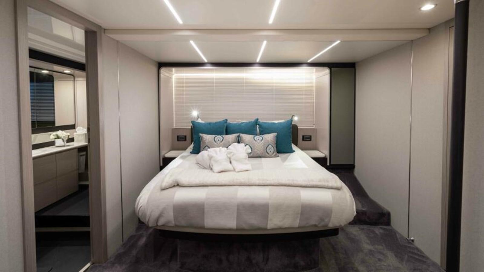 a bed in a room aboard LIQUID ASSET Yacht for Sale