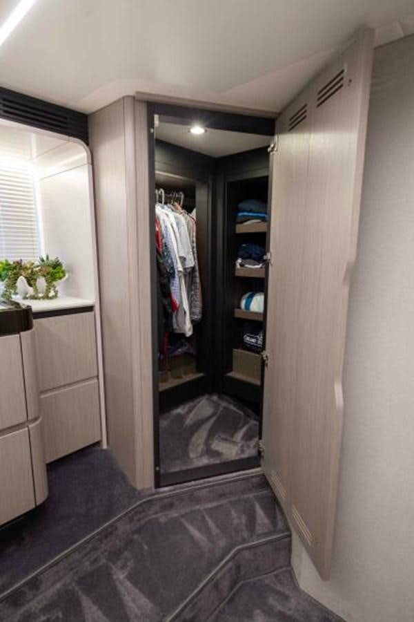 a closet with a mirror aboard LIQUID ASSET Yacht for Sale