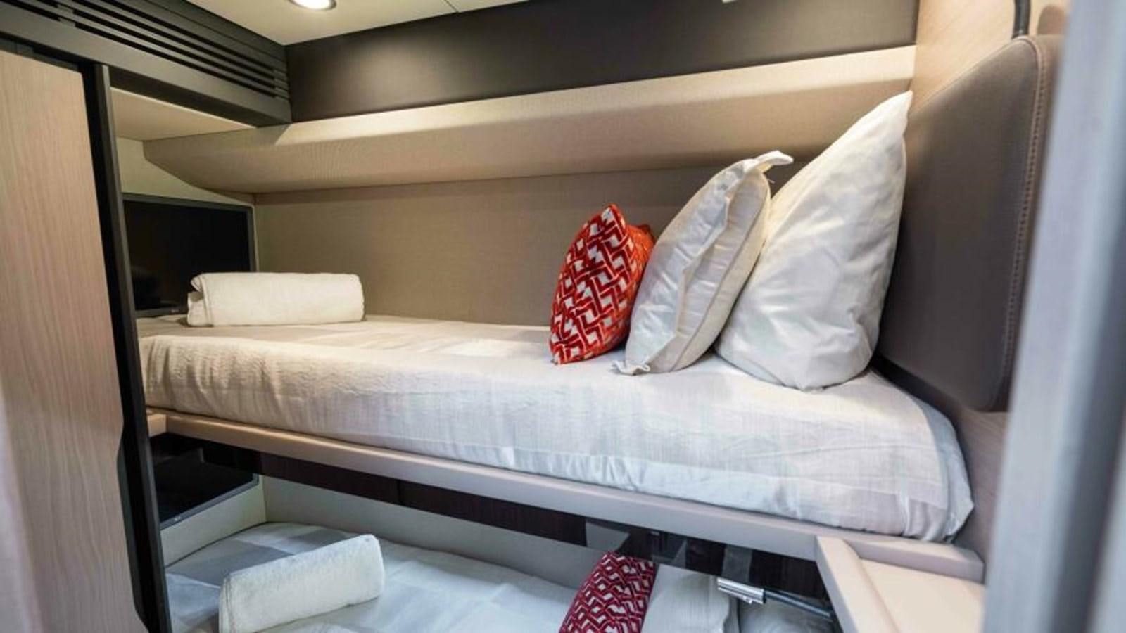 a bed with pillows aboard LIQUID ASSET Yacht for Sale