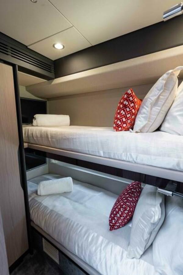 a room with bunk beds aboard LIQUID ASSET Yacht for Sale