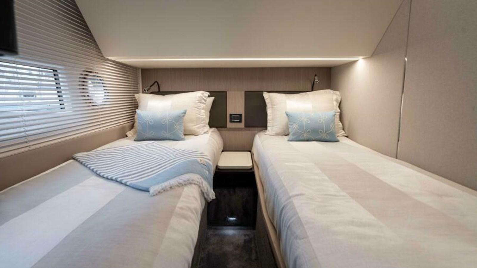 a couple of beds in a room aboard LIQUID ASSET Yacht for Sale