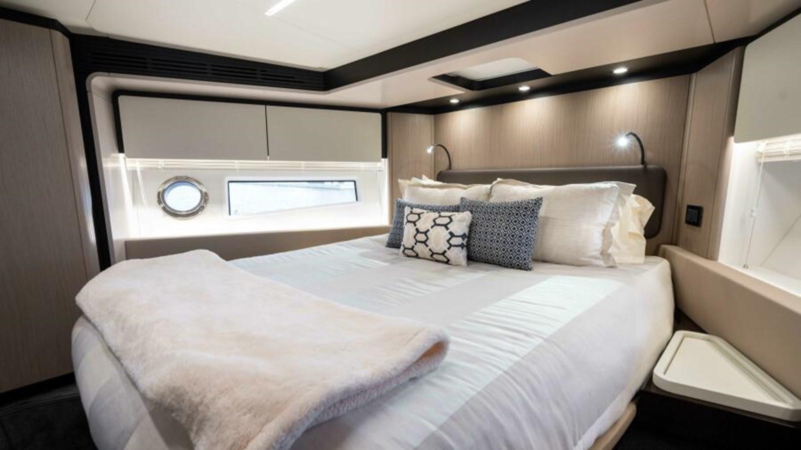 a couple of beds in a room aboard LIQUID ASSET Yacht for Sale