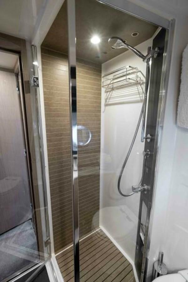 a bathroom with a shower unit aboard LIQUID ASSET Yacht for Sale