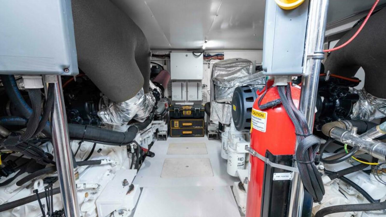 a few people working in a factory aboard LIQUID ASSET Yacht for Sale