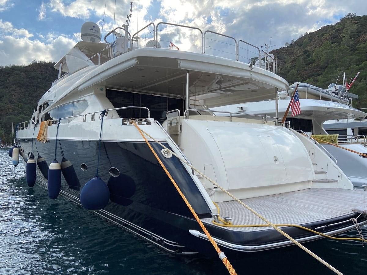 a boat docked at a pier aboard 95 MY Yacht for Sale