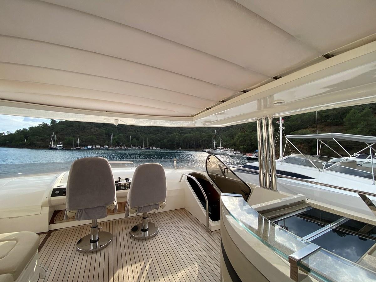 a boat with chairs and tables aboard 95 MY Yacht for Sale