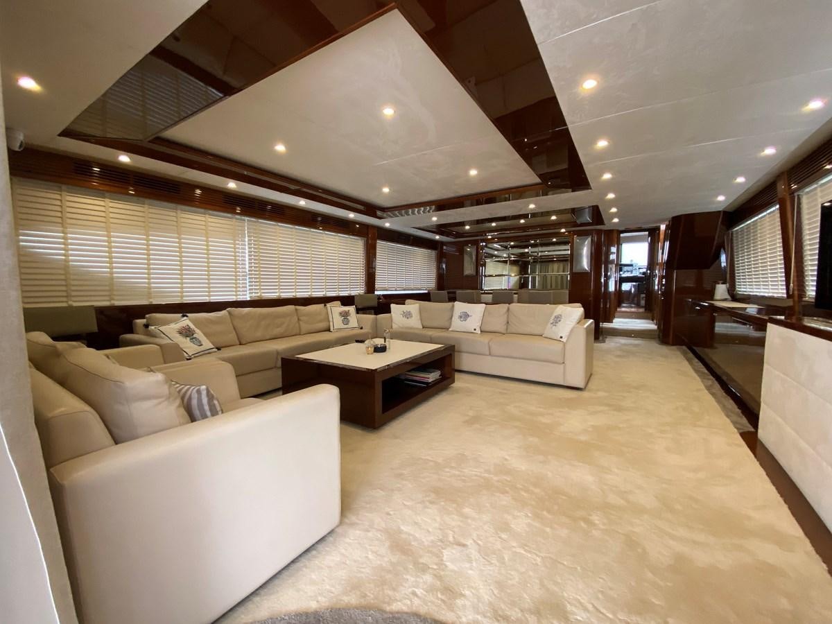 a large living room with a large window aboard 95 MY Yacht for Sale