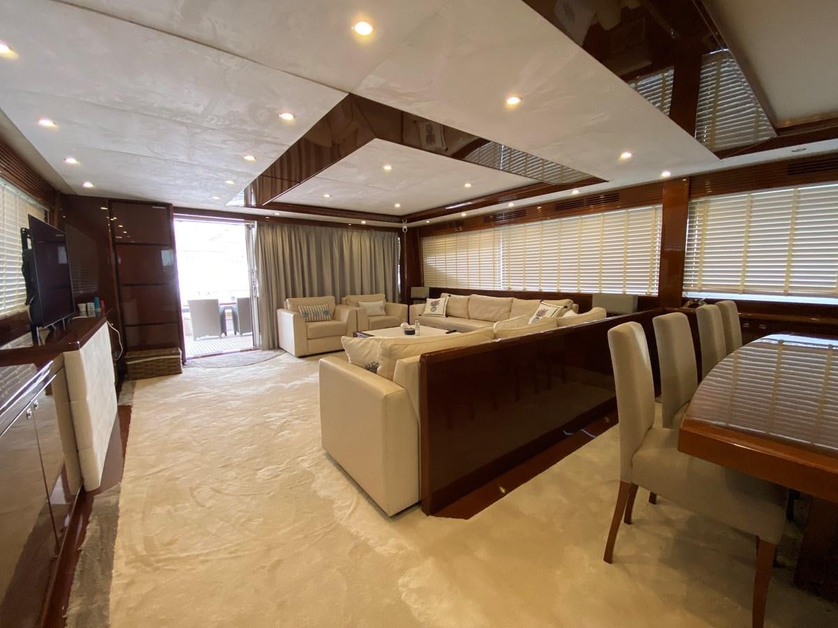 a large room with a bed and a couch aboard 95 MY Yacht for Sale