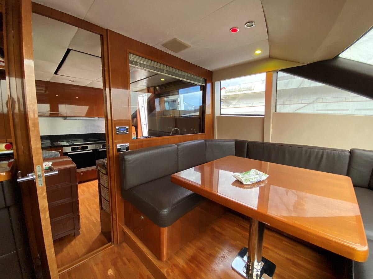 a room with a table and chairs aboard 95 MY Yacht for Sale