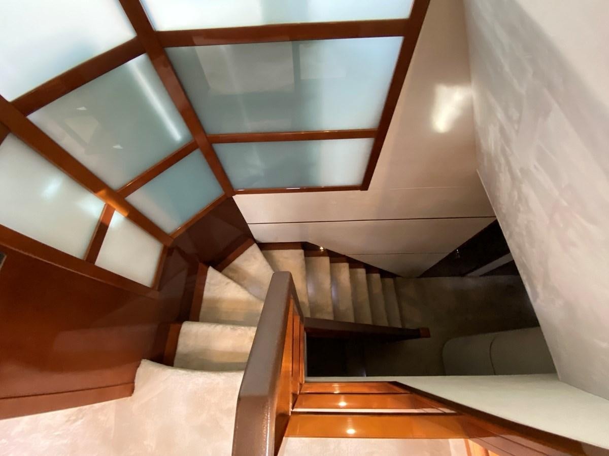 a staircase with a glass window aboard 95 MY Yacht for Sale