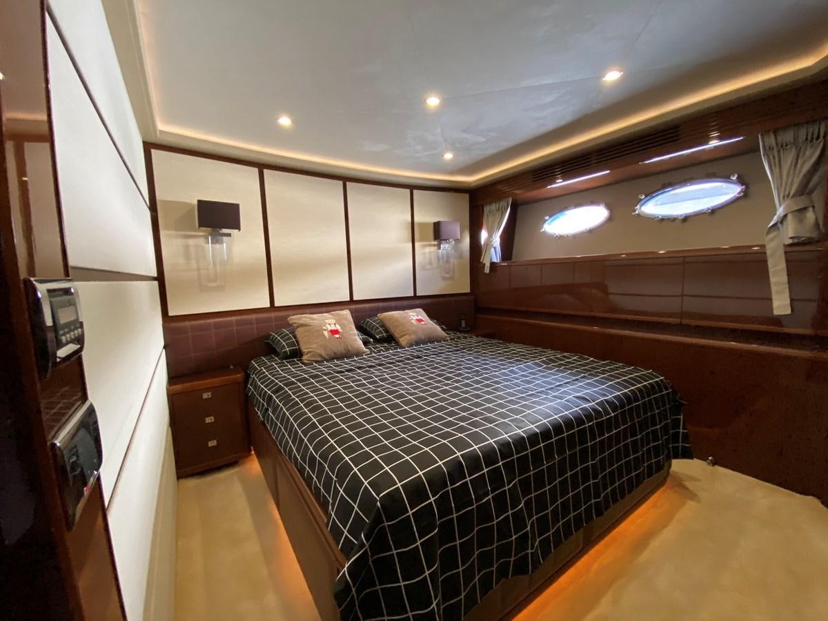 a bedroom with a bed aboard 95 MY Yacht for Sale