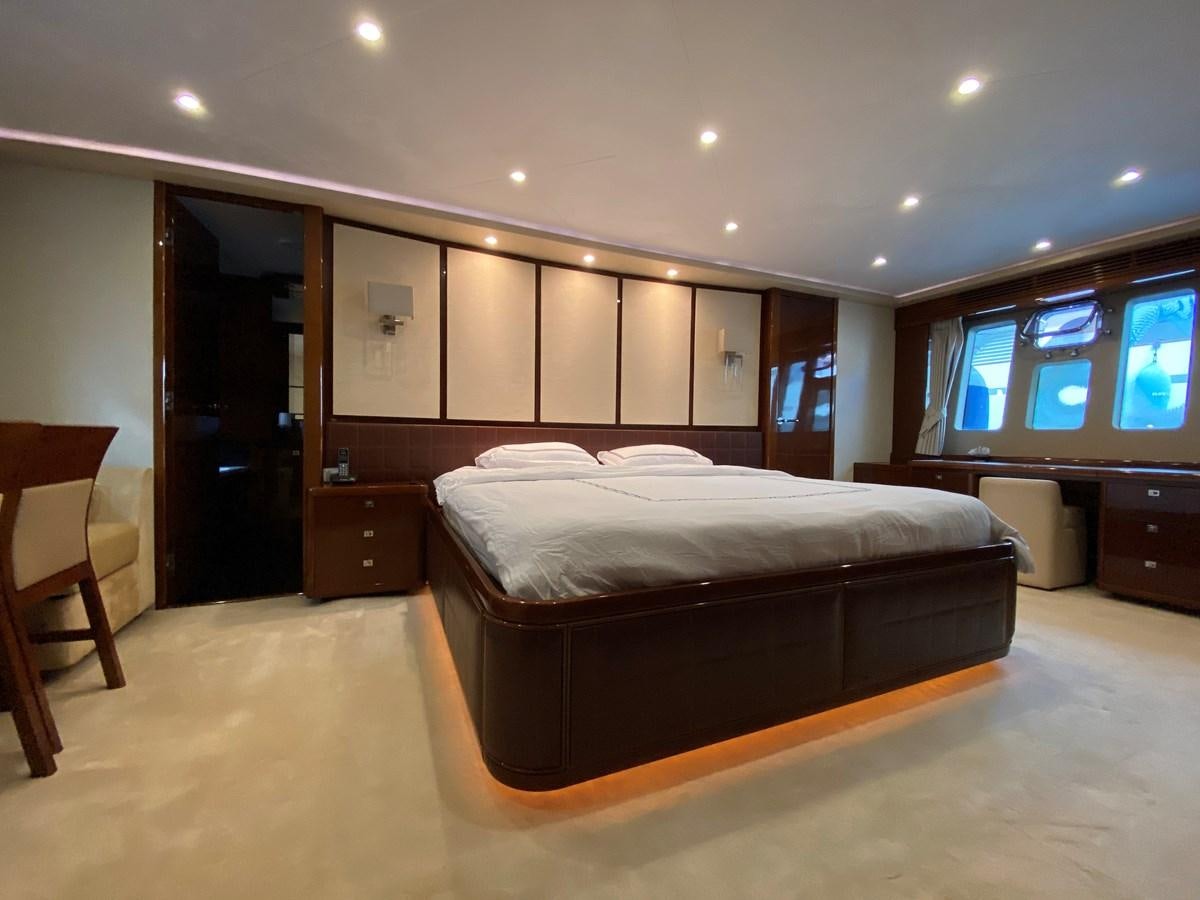 a bed in a room aboard 95 MY Yacht for Sale