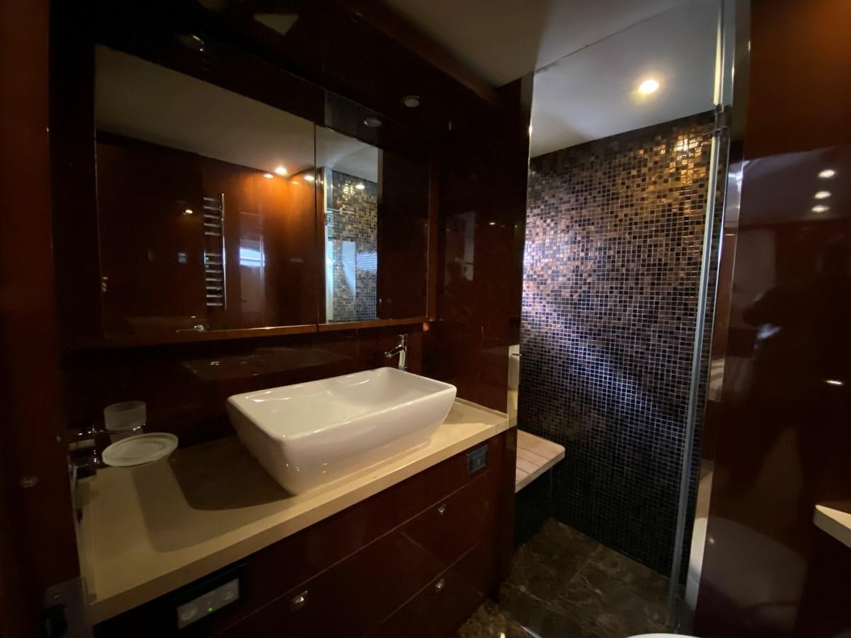 a bathroom with a sink and a shower aboard 95 MY Yacht for Sale