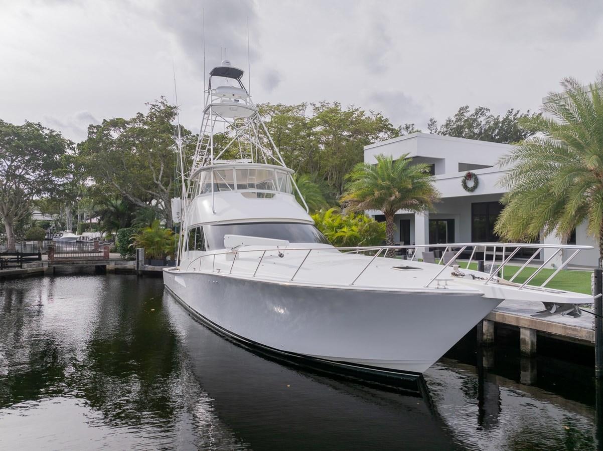 a white boat docked aboard STABILIZED Yacht for Sale