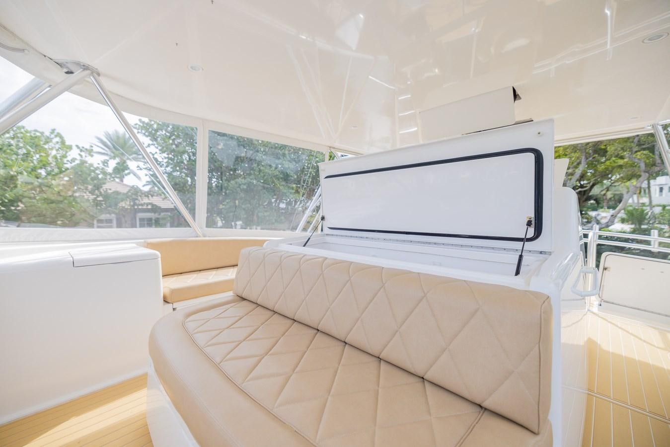 a white couch in a room aboard STABILIZED Yacht for Sale
