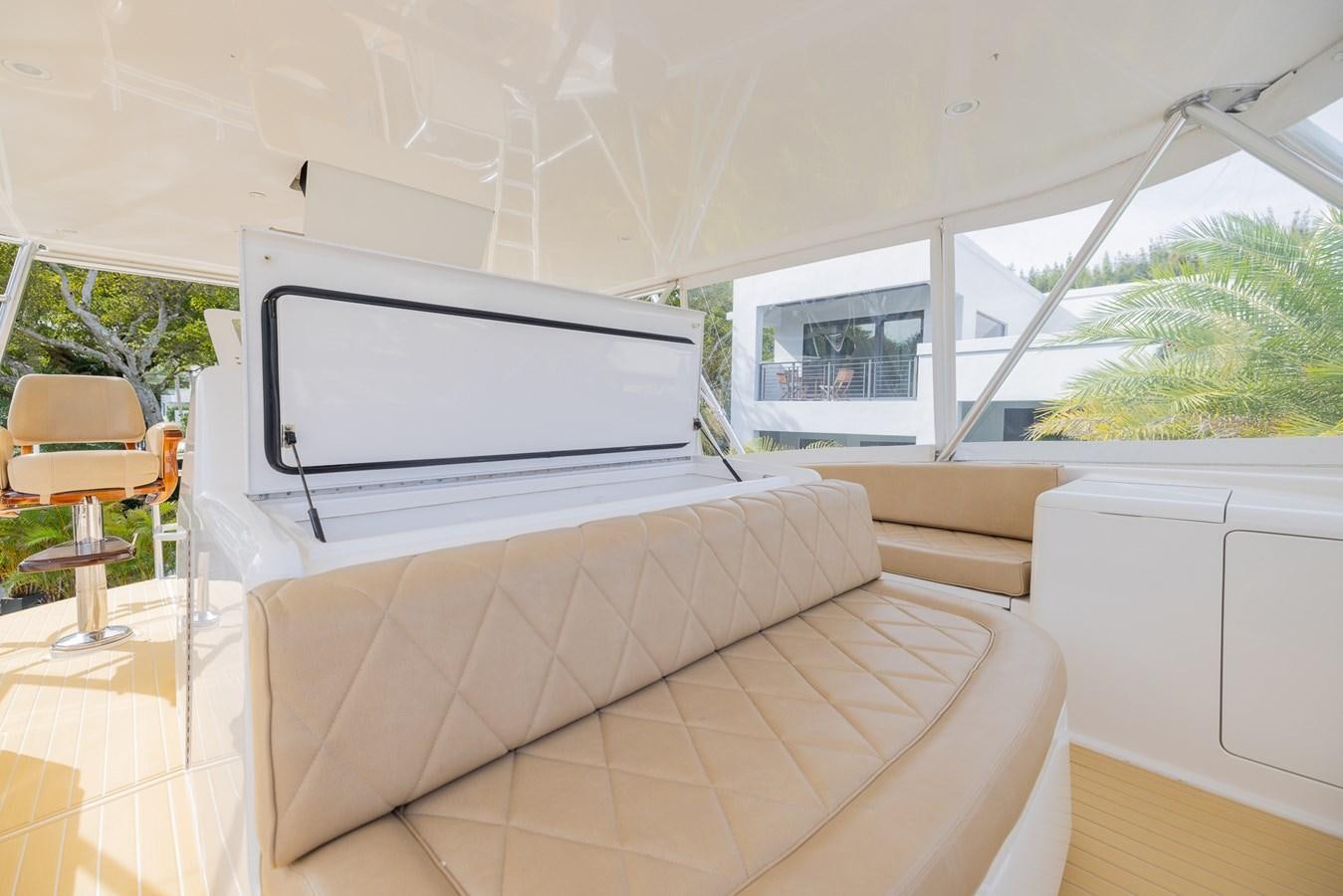 a living room with a couch and a television aboard STABILIZED Yacht for Sale