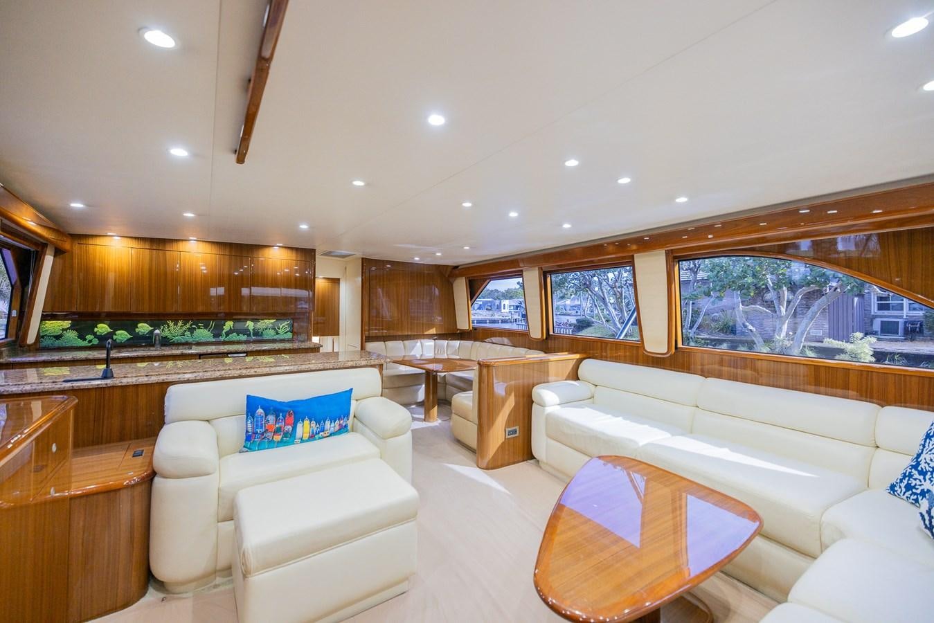 a living room with a large window aboard STABILIZED Yacht for Sale