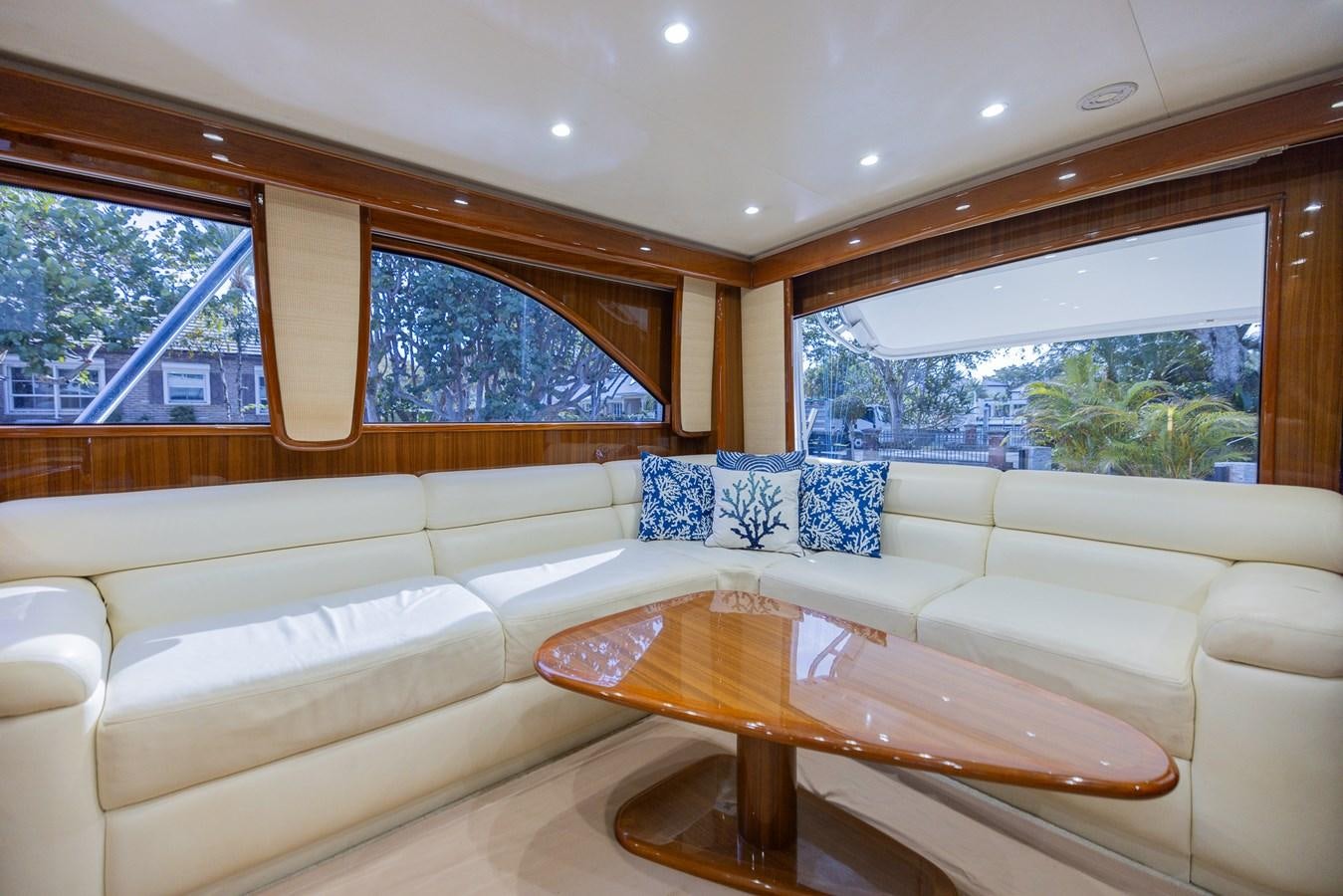 a living room with a large window aboard STABILIZED Yacht for Sale