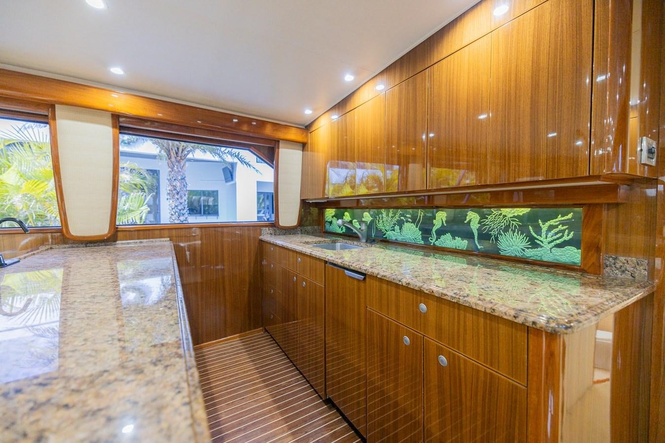 a kitchen with a marble counter top aboard STABILIZED Yacht for Sale