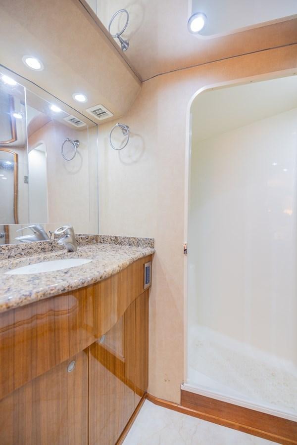 a bathroom with a sink and a mirror aboard STABILIZED Yacht for Sale