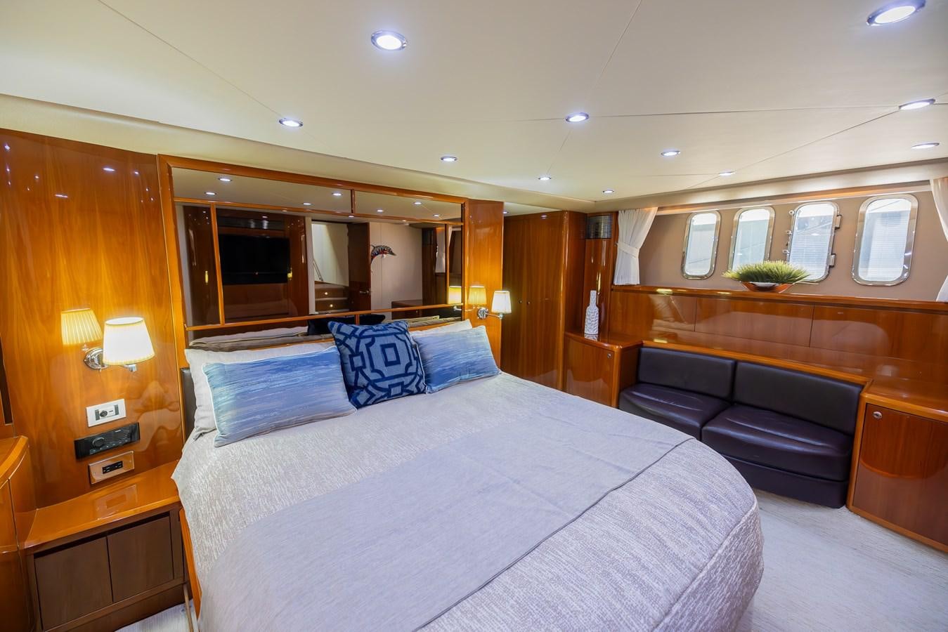 a large bed in a hotel room aboard ODYSSEA Yacht for Sale