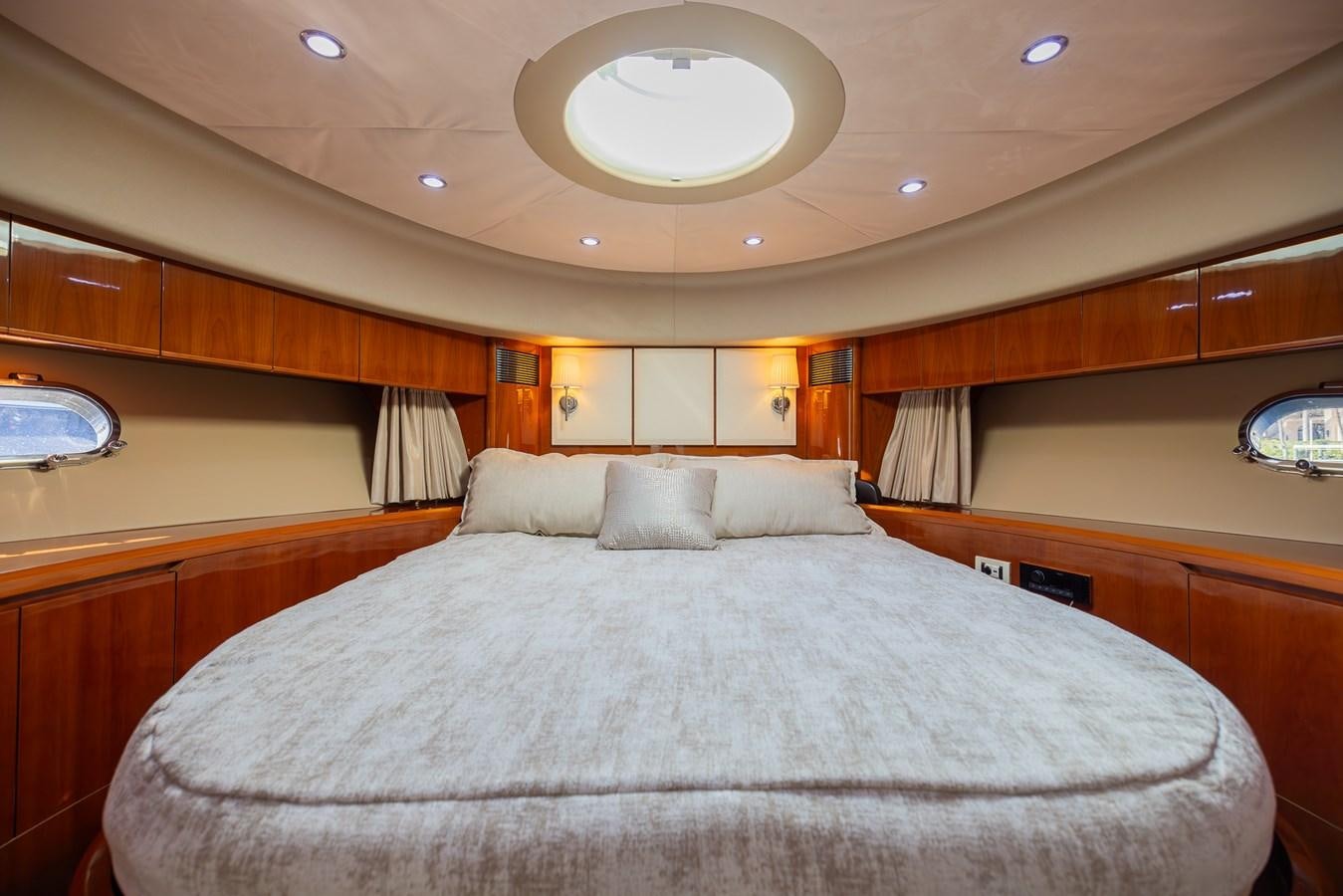 a large bed in a room aboard ODYSSEA Yacht for Sale