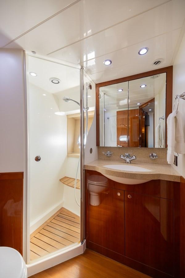 a bathroom with a sink and a toilet aboard ODYSSEA Yacht for Sale