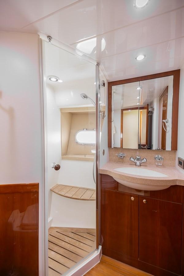 a bathroom with a shower and sink aboard ODYSSEA Yacht for Sale