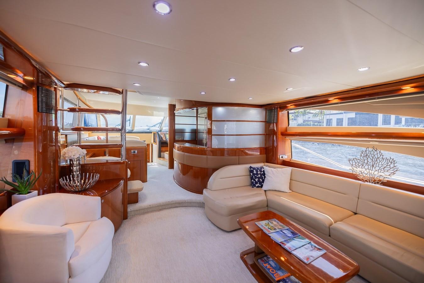 a living room with a large window aboard ODYSSEA Yacht for Sale