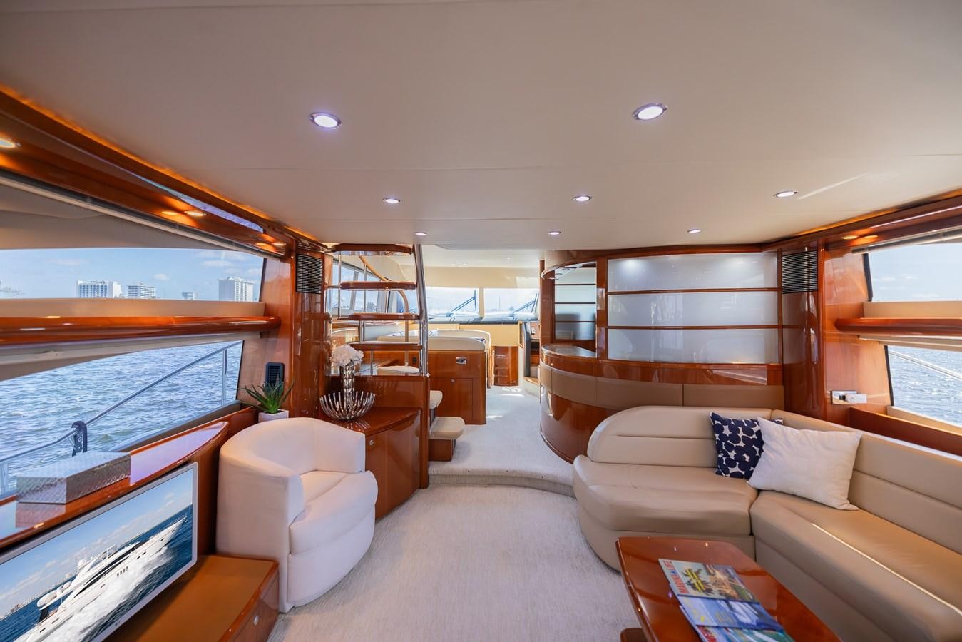 a living room with a large window aboard ODYSSEA Yacht for Sale