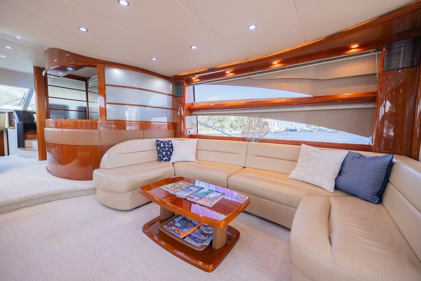 a living room with a couch and a coffee table aboard ODYSSEA Yacht for Sale