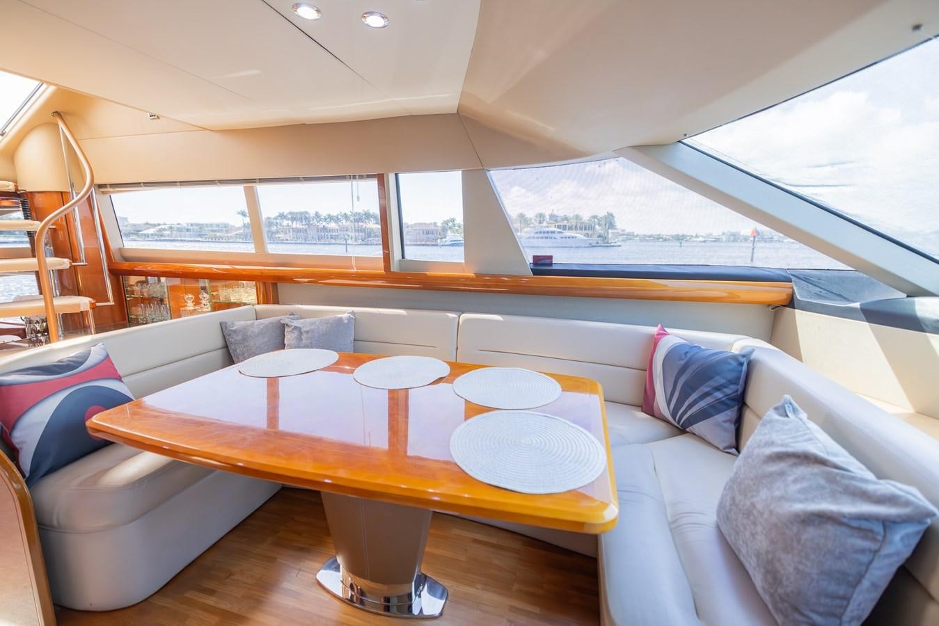 a boat with a table and chairs aboard ODYSSEA Yacht for Sale