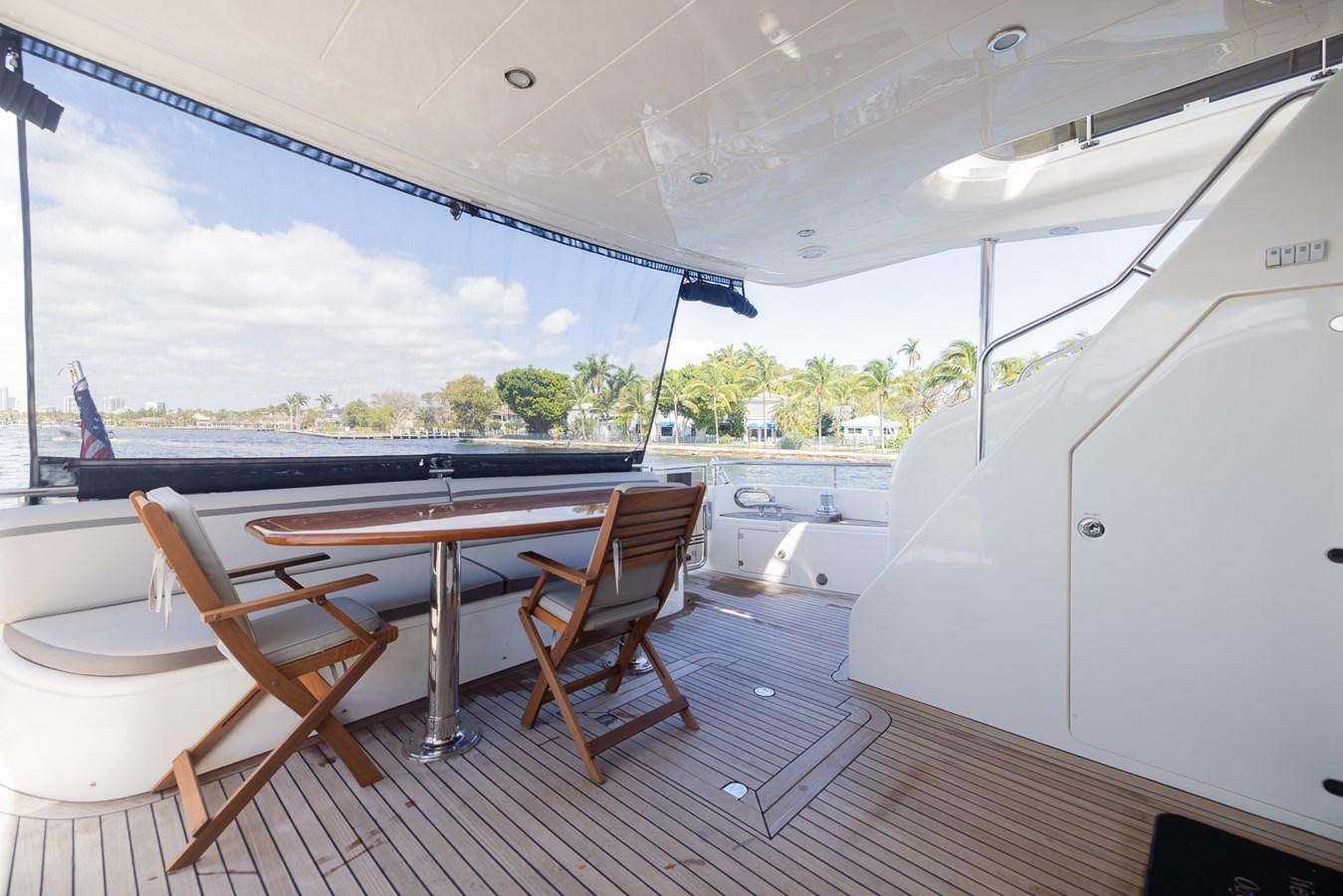 a room with a table and chairs aboard ODYSSEA Yacht for Sale
