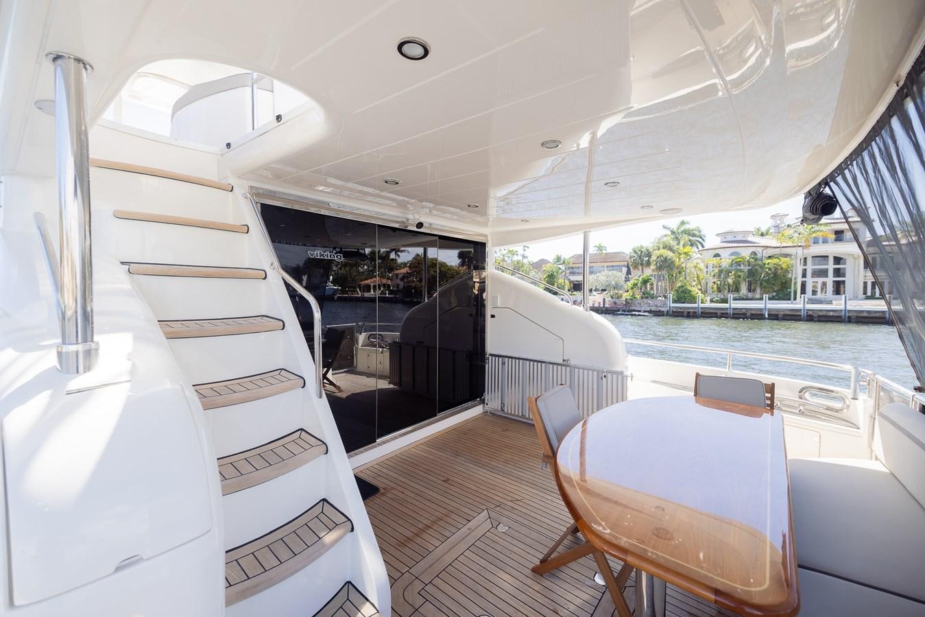 a room with a table and chairs aboard ODYSSEA Yacht for Sale