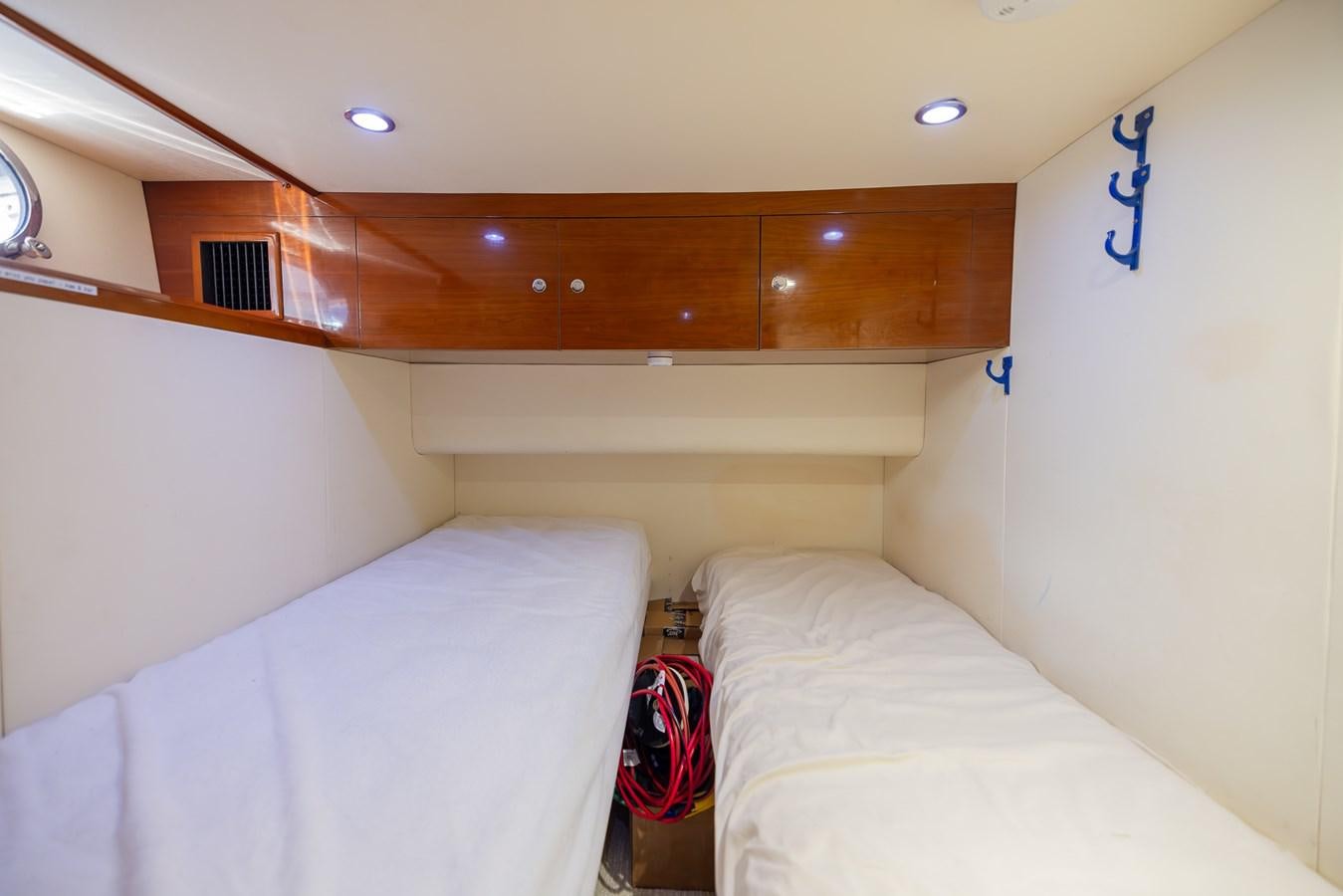 a room with two beds aboard ODYSSEA Yacht for Sale