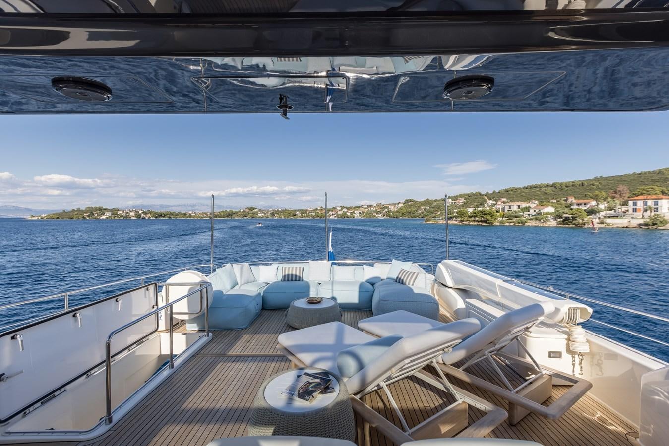 a deck with a view of a city and water aboard KATARIINA XO Yacht for Charter