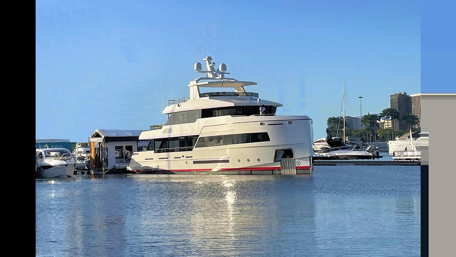 a large white boat in a harbor aboard 2024 INACE EXPLORA 115 Yacht for Sale