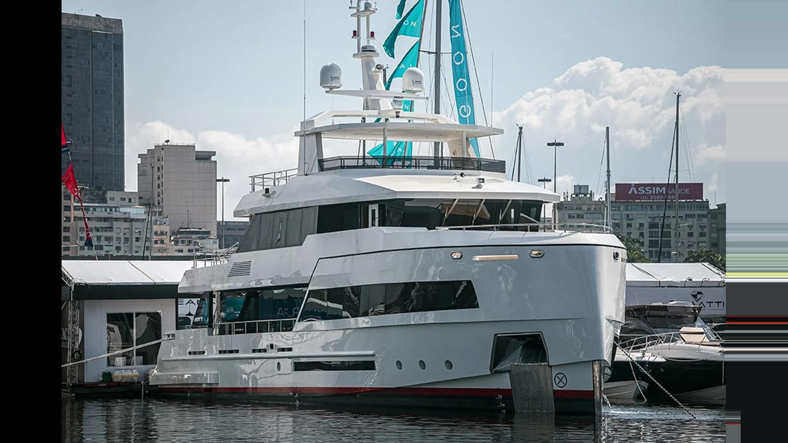 a large white boat in a harbor aboard 2024 INACE EXPLORA 115 Yacht for Sale