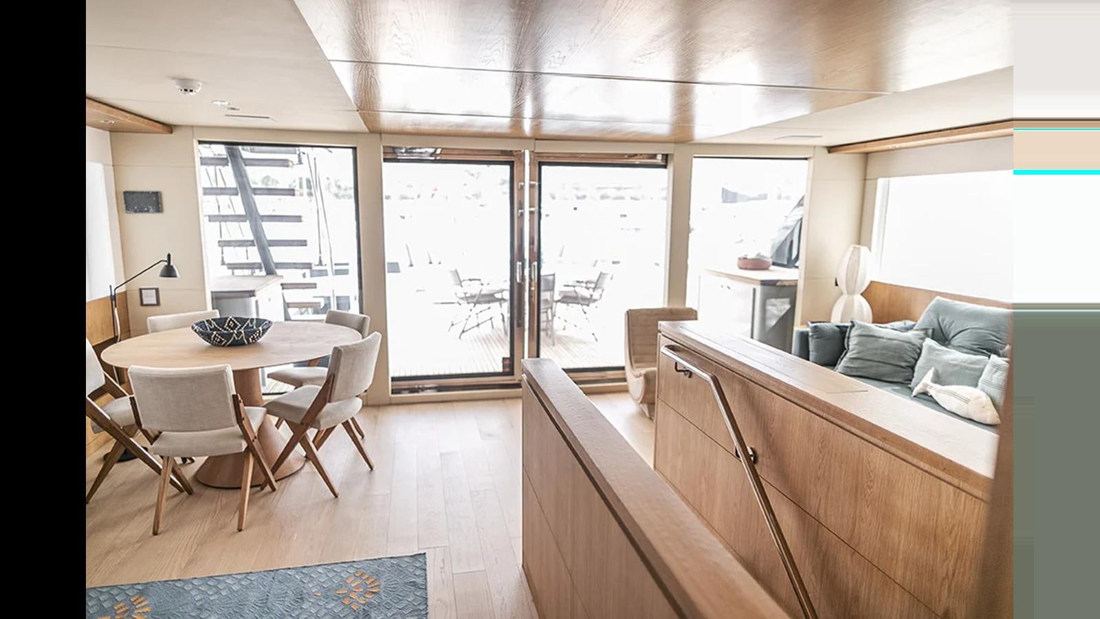 a living room with a couch and a table aboard 2024 INACE EXPLORA 115 Yacht for Sale