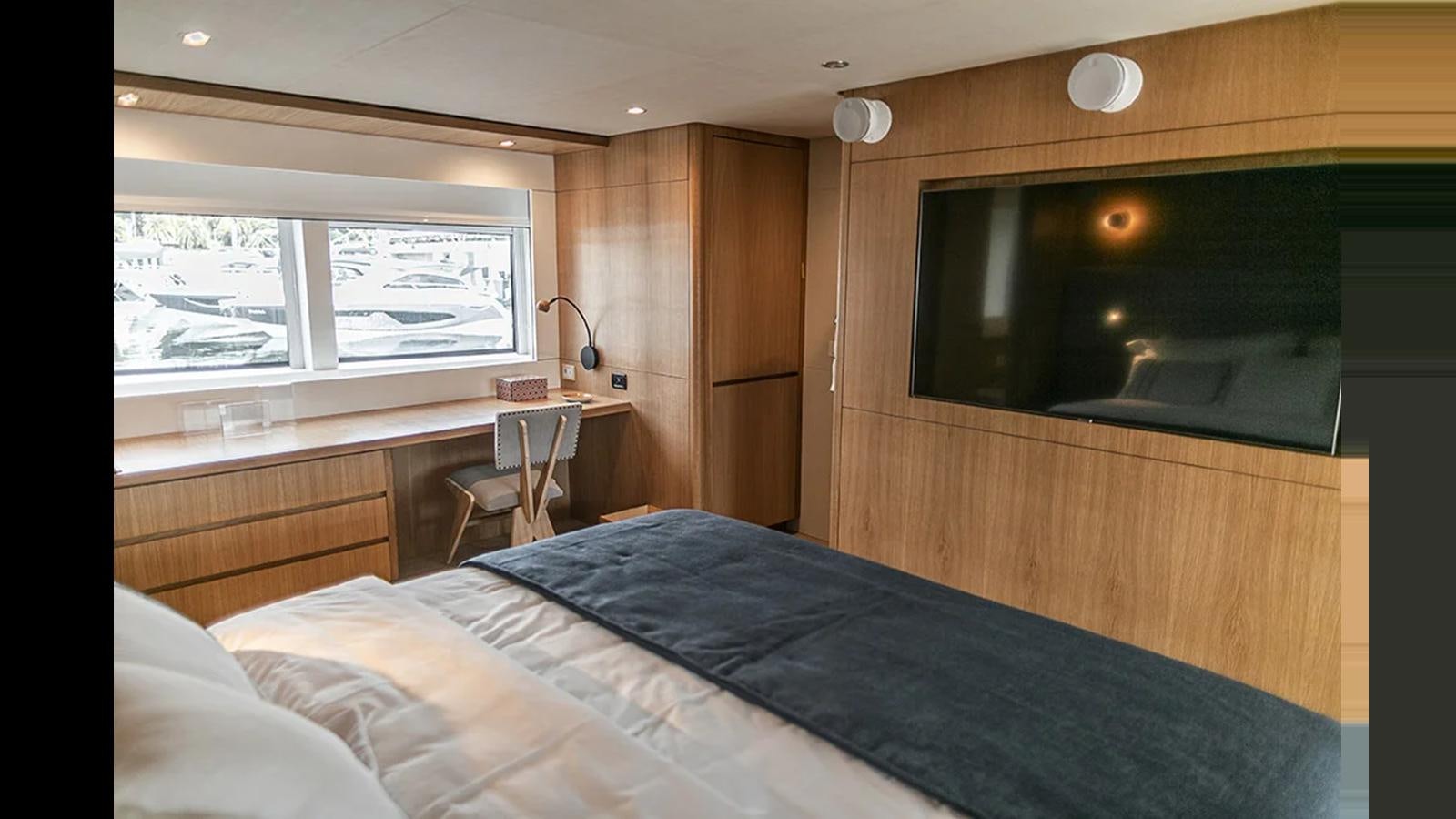 a bedroom with a bed and a desk aboard 2024 INACE EXPLORA 115 Yacht for Sale