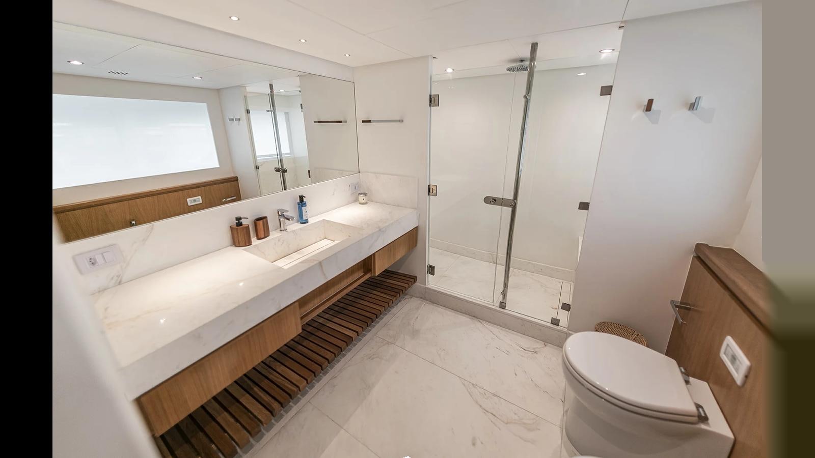a bathroom with a tub sink and a shower unit aboard 2024 INACE EXPLORA 115 Yacht for Sale
