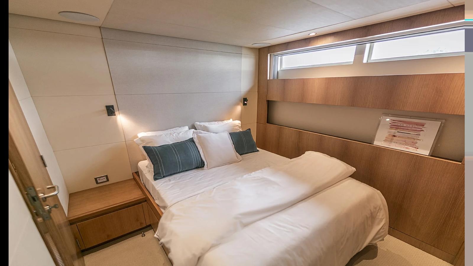 a room with a bed and a couch aboard 2024 INACE EXPLORA 115 Yacht for Sale